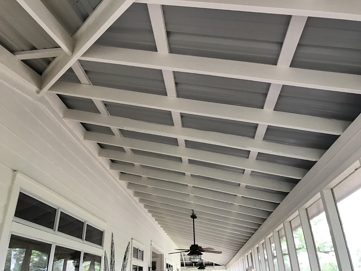 Covered porch with finished white beam ceiling