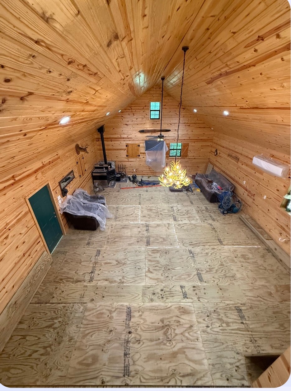 Cabin interior renovation with vaulted pine ceiling